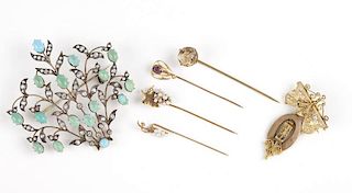 A collection of antique brooches and pins