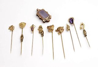 A collection of gold and gold-filled stick pins