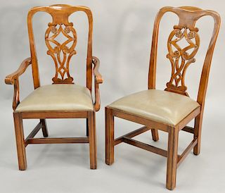 Set of six dining chairs, all with carved backs to include two arm chairs and four side chairs. 
