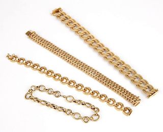 A collection of gold chain bracelets