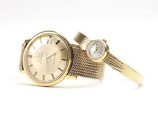 A group of two Omega gold wristwatches