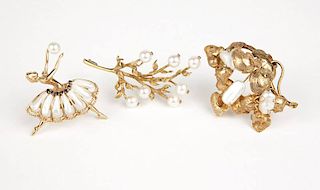 A group of three cultured pearl and gold brooches