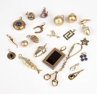 A collection of gold and gem-set charms