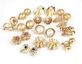 A collection of gold earclips