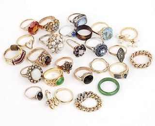 A collection of gem and gold rings