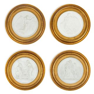 A Group of Four Bisque Plaques <br>each set in a 