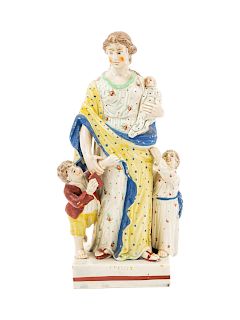 A Staffordshire Pottery Figure of Charity<br>Heig