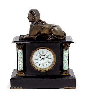 A Mantel Clock<br>decorated with a sphinx.<br>Hei