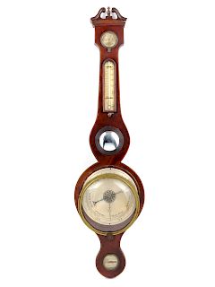 An English Mahogany Wheel Barometer<br>Height 38 
