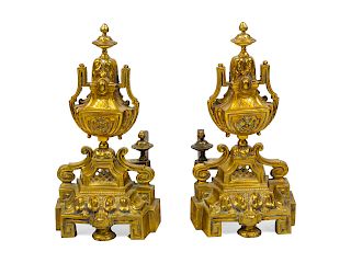 A Pair of Brass Andirons<br>together with two fir