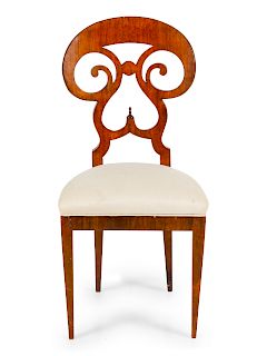 A Biedermeier Walnut Side Chair<br>having a round