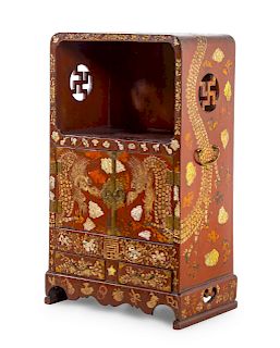 A Chinese Lacquered Cabinet<br>having a vacant sh