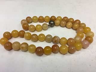 Chinese yellow jade bead necklace.