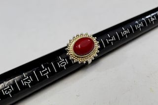Silver and red coral ring.
