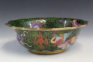 Chinese cloisonne punch bowl with dragon and phoenix decoration.