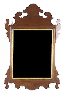 A Chippendale Style Mahogany Parcel Gilt Mirror, Height 18 3/4 x width 12 1/4 inches.
