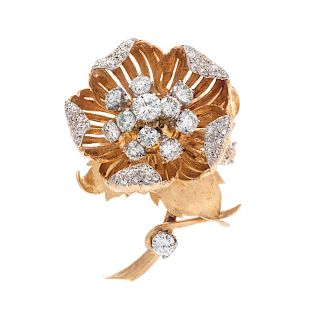 A Bicolored Gold and Diamond En Tremblant Flower Brooch,