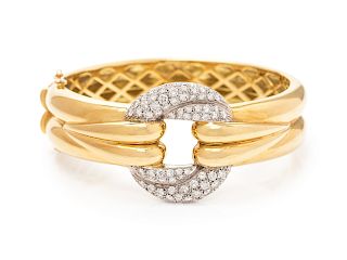An 18 Karat Bicolor Gold and Diamond Bangle Bracelet,