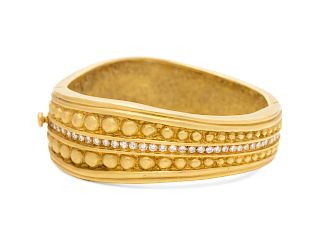 An 18 Karat Yellow Gold and Diamond Bangle Bracelet,