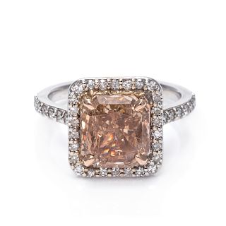 A 14 Karat White Gold, Fancy Brown-Orange Diamond and Diamond Ring,