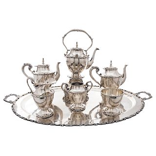 TEA SET. MEXICO, 20TH CENTURY. Sterling 0.925 Silver. Comprising a teapot, coffee pot, lampstand, cream jug, sugar bowl, waste bowl and tray. 7 pieces