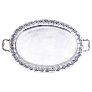 TRAY. MEXICO, 20TH CENTURY.  Sterling 0.925 Silver. Ovoid form with repoussé details. The handles chased and embossed with floral motifs.