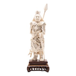 WARRIOR. CHINA, CIRCA 1900.  Carved ivory model with ink details. 