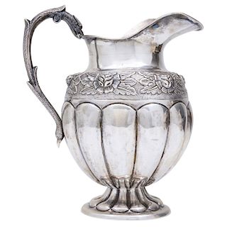 JUG. MEXICO, 20TH CENTURY. Silver. The body with repoussé with chased strapwork. Decorated with floral details. Double headed handle as a snake and a 