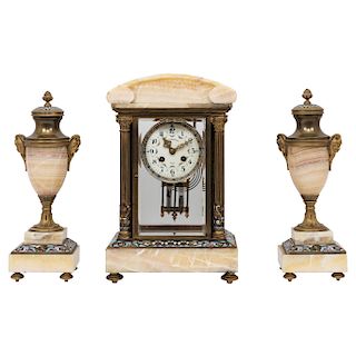 CLOCK GARNITURE. FRANCE, CIRCA 1900. Empire Style. Gilt-bronze, brass, cloisonné enamel and marble. With clock and a pair of matching urnes.