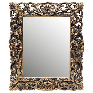 MIRROR. BEGINNING OF THE 20TH CENTURY. Carved and gilt wood. Decorated with acanthus and clam shell details. Bevelled edges.