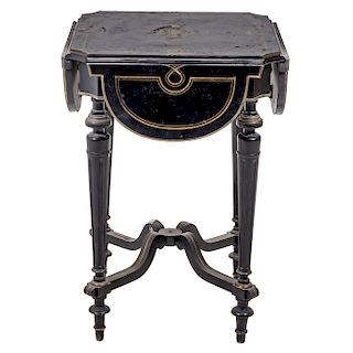 DROP-LEAF TABLE. FRANCE, CIRCA 1900. Napoleon III Style. Ebonised wood with brass details. With four hinged lobs. 