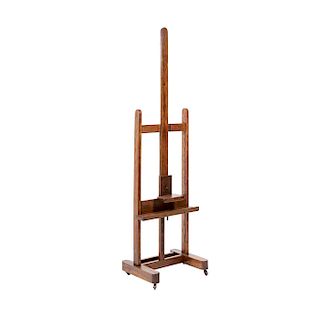 EASEL. BEGINNING OF THE 20TH CENTURY. Wooden easel with height adjustable mechanism. 
