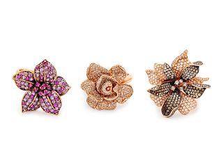A Collection of Rose Gold and Diamond Flower Rings,
