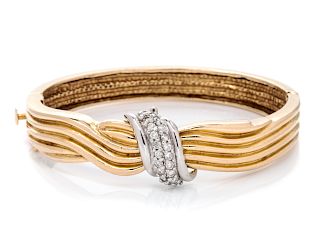 A 14 Karat Bicolor Gold and Diamond Bangle Bracelet,