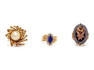 A Collection of 14 Karat Yellow Gold and Multigem Rings,