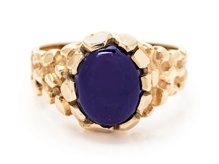 A 14 Karat Yellow Gold and Purple Hardstone Ring,