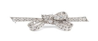 A Platinum and Diamond Bow Brooch,