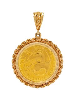A 14 Karat Yellow Gold and 50 Yuan Coin Pendant,