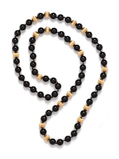 A Yellow Gold and Onyx Bead Necklace,