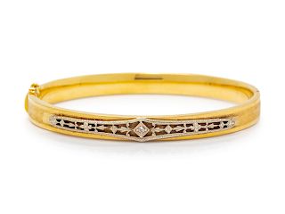 A Bicolor Gold and Diamond Bangle Bracelet,