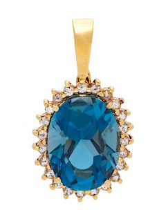 A 14 Karat Yellow Gold, Blue Topaz and Diamond Pendant,