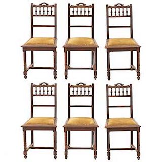 Lote de 6 sillas. Francia. SXX. Estilo Enrique II. En talla de madera de nogal. Con respaldos semiabiertos y asientos en tapicería.