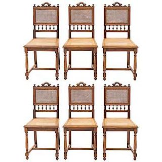 Lote de 6 sillas. Francia. Siglo XX. Estilo Enrique II. En talla de madera de nogal. Con respaldos semiabiertos y asientos de bejuco.