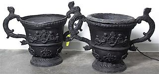 A Pair of Composition Garden Urns, Height 22 x width over handles 30 1/4 inches.