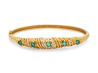 A 14 Karat Yellow Gold, Emerald and Diamond Bangle Bracelet,