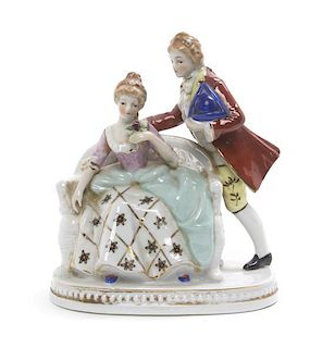 A Maruyama Porcelain Figural Group, Height 6 inches.