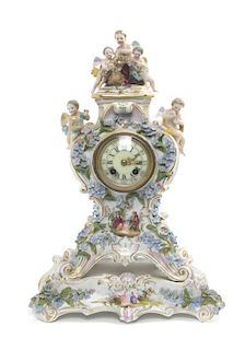 A Continental Porcelain Mantel Clock and Stand, Height of clock 13 1/2 inches.