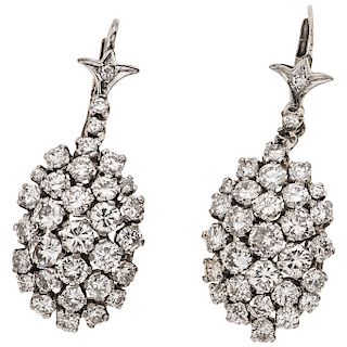 A diamond palladium silver pair of earrings.