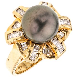 A cultured pearl and diamond 18K yellow gold ring.