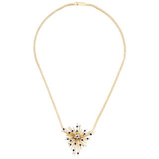 A lazurite and diamond 18K yellow gold pendant and 16K yellow gold necklace.